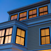 A building with many windows at night time.